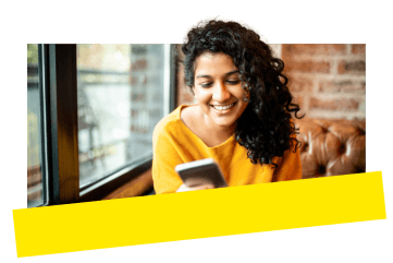 Young professional using GoTo Meeting on their mobile device in a cafe.